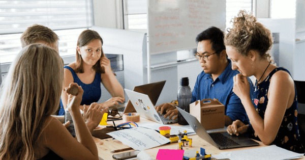 virtual receptionists gathering around a table