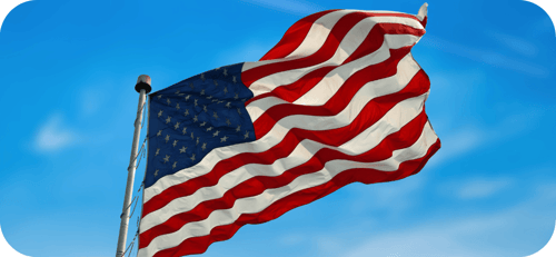 american flag waving in the sky