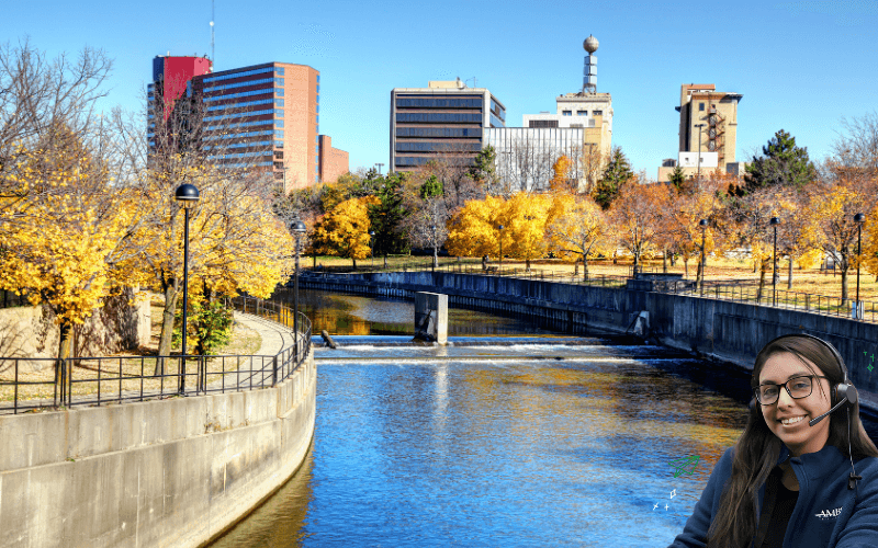 river in flint michigan with ambs call center phone answering service agent in front