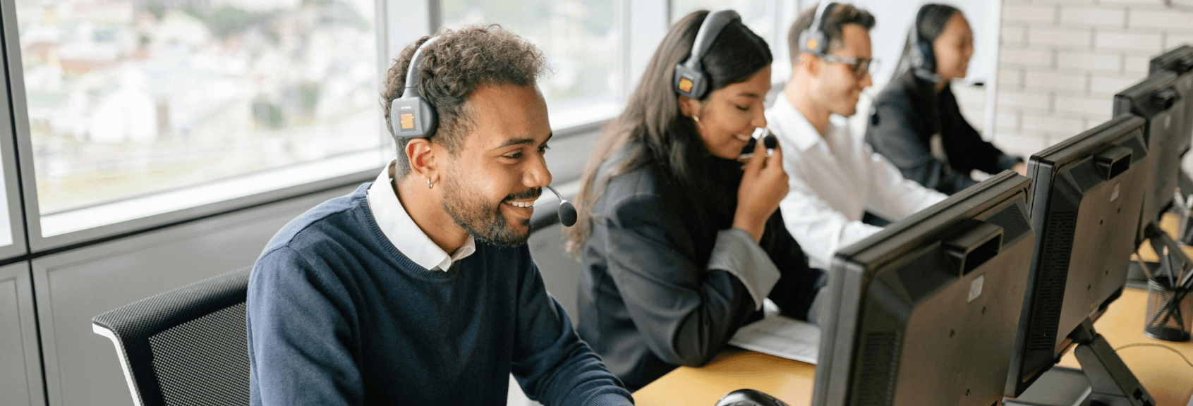 call center agents sitting answering calls with one another